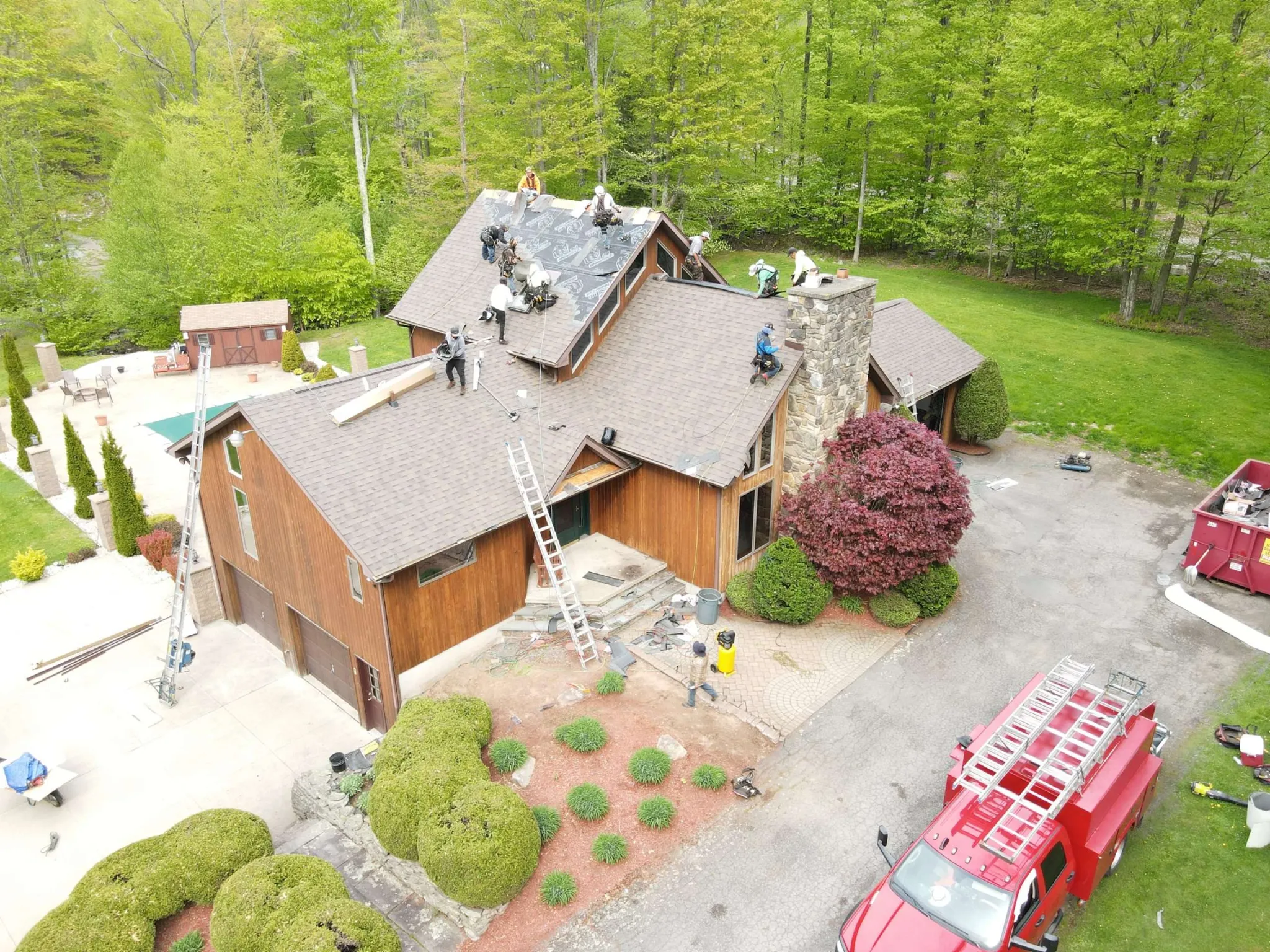 Aerial view of a TC Roofing Pros crew installing a new roof in Northeastern Pennsylvania