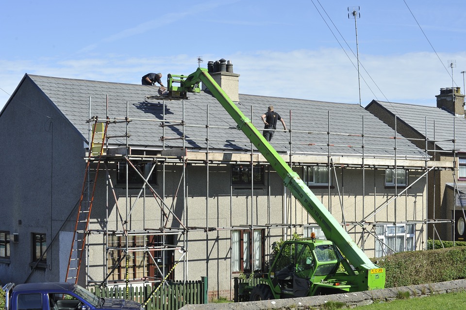TC Roofing Pros crew working from scaffolding