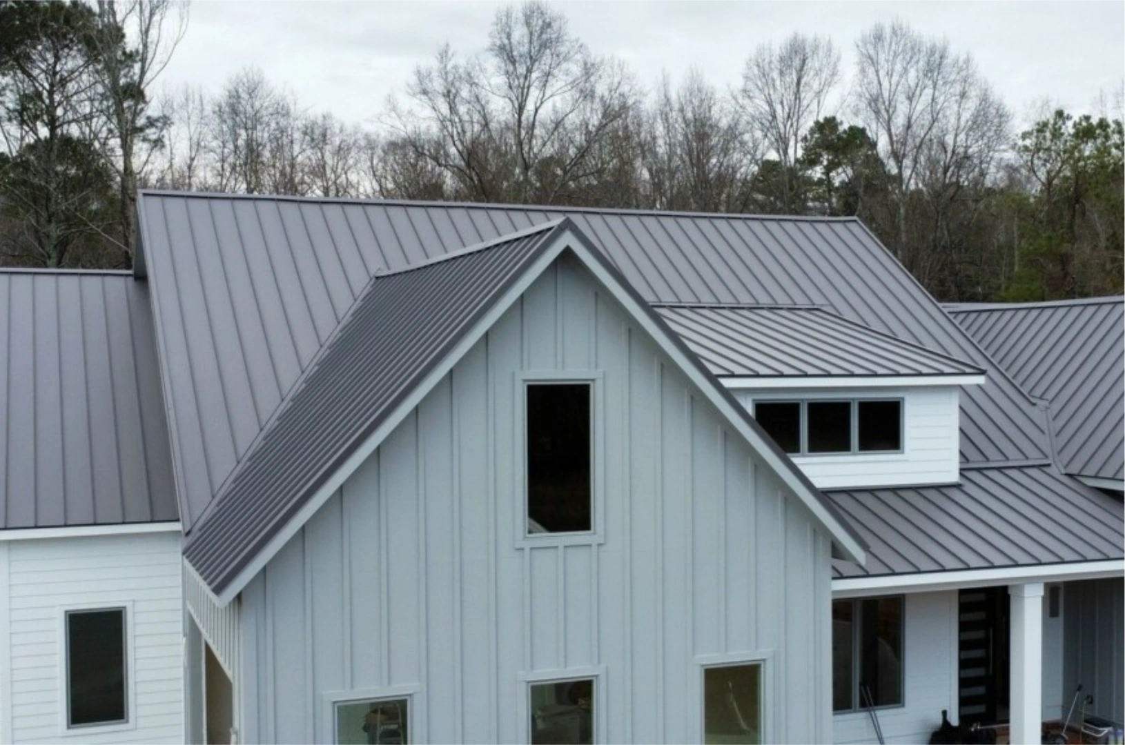 Finished standing-seam metal roof on a modern farmhouse